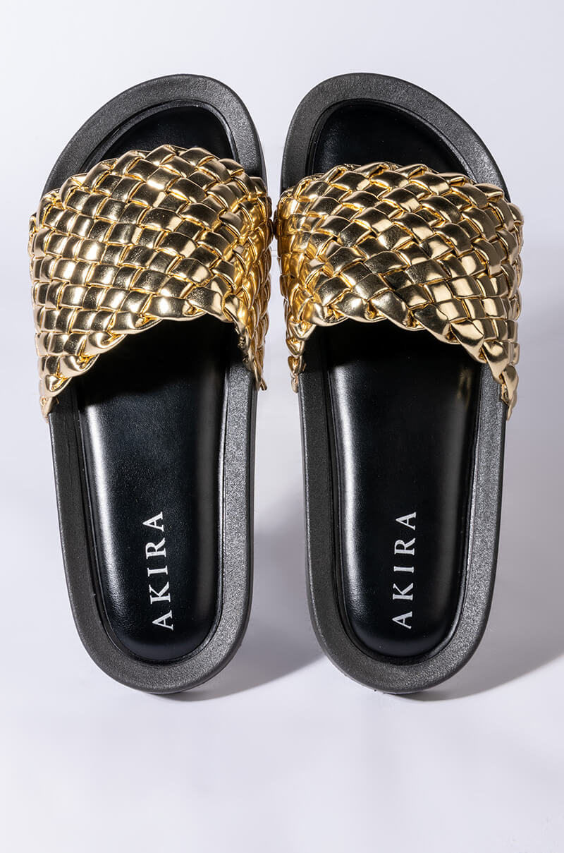 TWISTED LOVE FLAT SANDAL IN GOLD