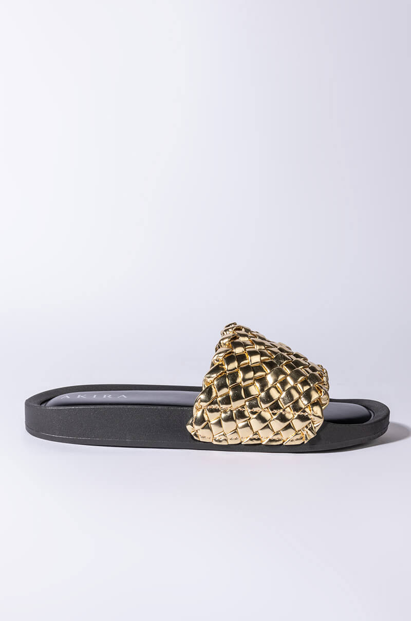 TWISTED LOVE FLAT SANDAL IN GOLD
