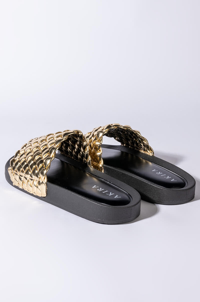 TWISTED LOVE FLAT SANDAL IN GOLD