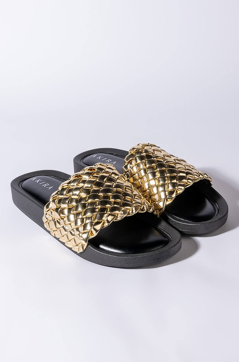 TWISTED LOVE FLAT SANDAL IN GOLD