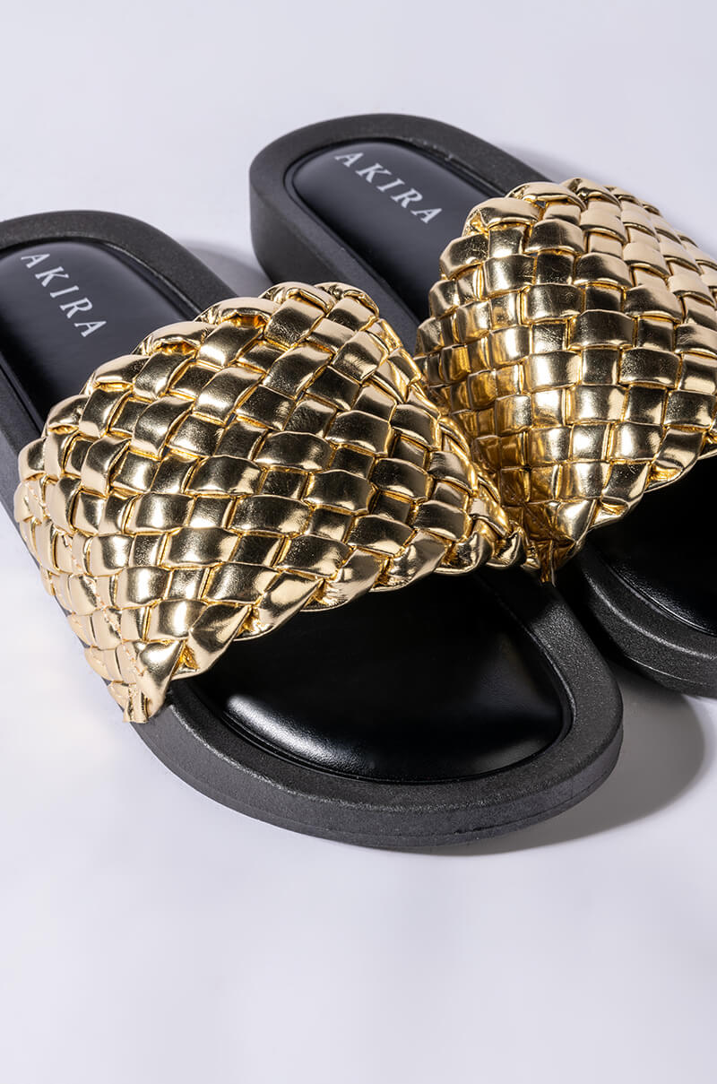 TWISTED LOVE FLAT SANDAL IN GOLD