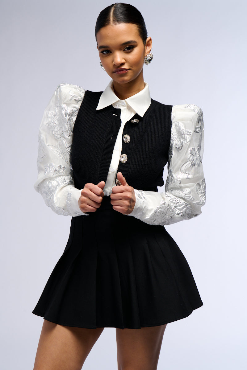 AN ELEGANT EVENING BUTTON DOWN CARDIGAN WITH BROCADE PUFF SLEEVES