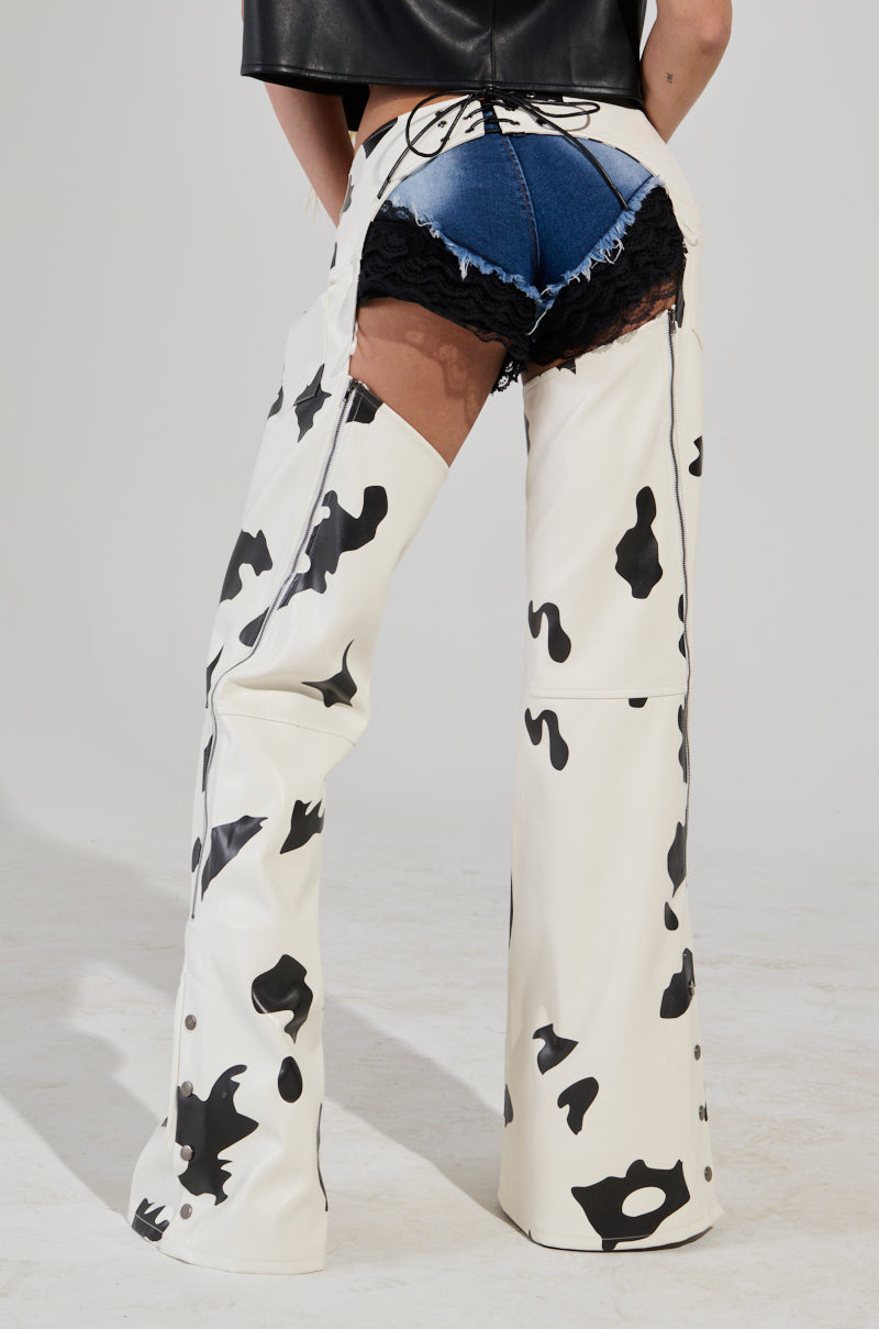 MOO OVER COW PRINT FAUX LEATHER CHAPS