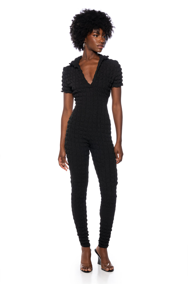 MAKE ME BELIEVE TEXTURED SHORT SLEEVE JUMPSUIT IN BLACK