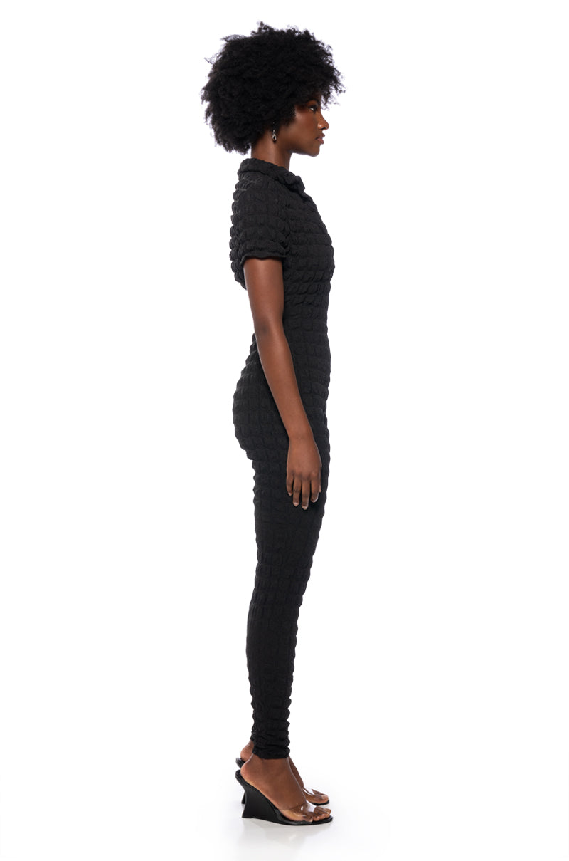 MAKE ME BELIEVE TEXTURED SHORT SLEEVE JUMPSUIT IN BLACK