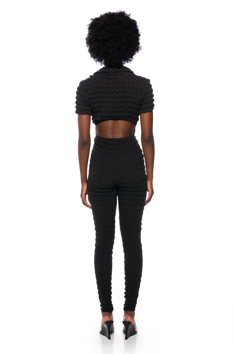 MAKE ME BELIEVE TEXTURED SHORT SLEEVE JUMPSUIT IN BLACK